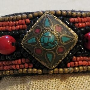 Tibetan beaded cuff bracelet with coral and turquoise boho cowrie shell bracelet